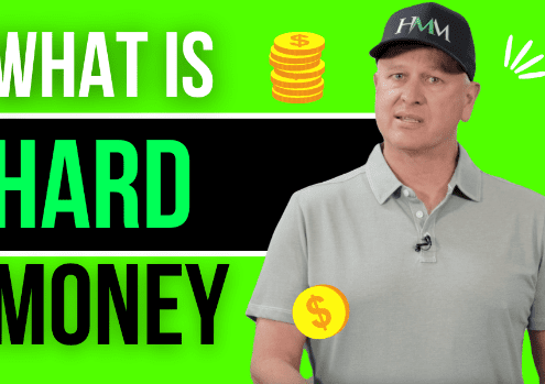 Text reads "What Is Hard Money." Mike Bonn stands with cartoon coins surrounding him.